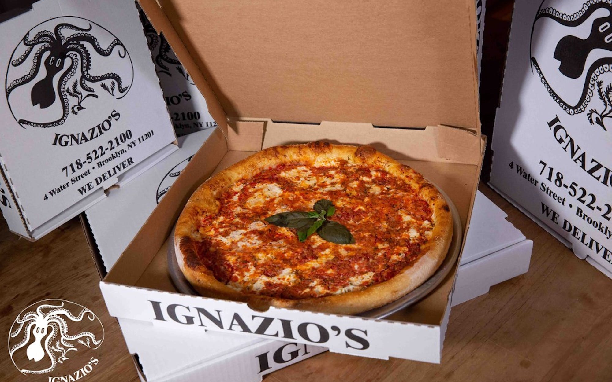 a box of pizza sitting on top of a table